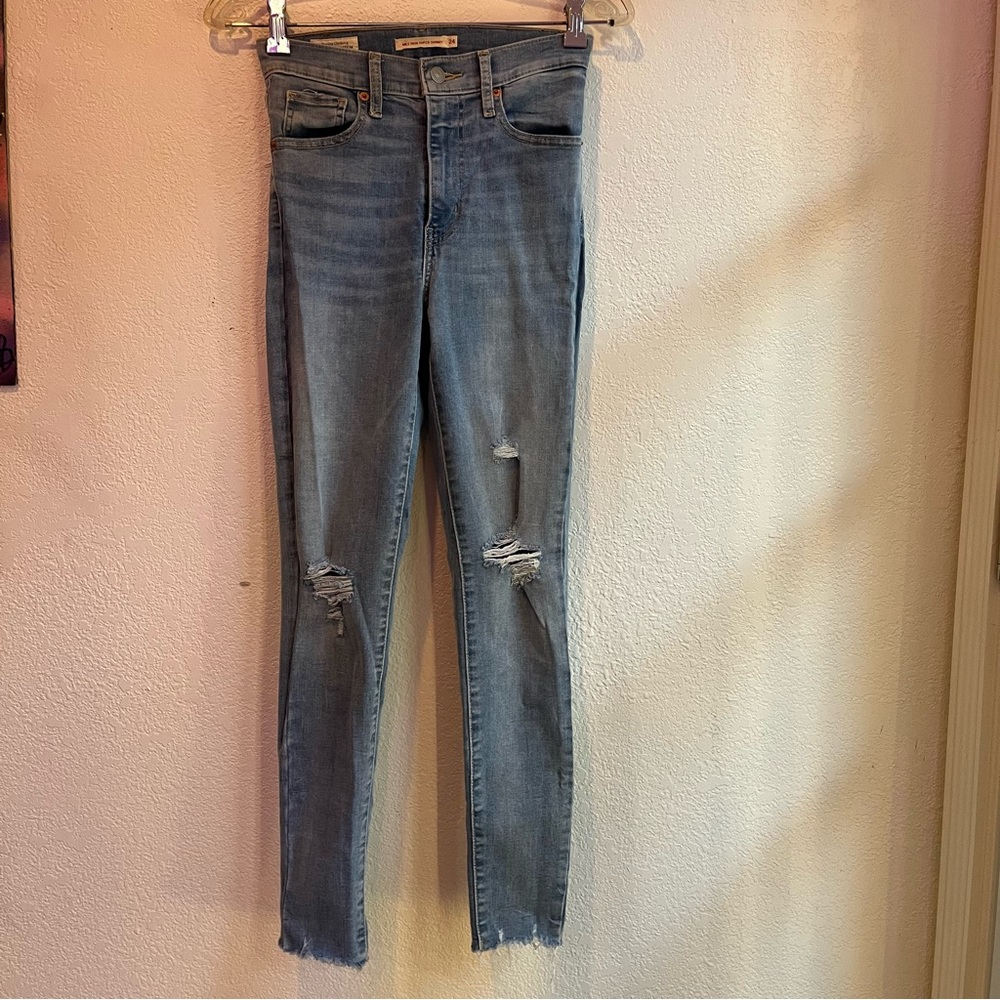 Levi’s Mile High Super Skinny Jeans with Holes and Frayed Bottoms